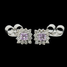 Load image into Gallery viewer, A pair of pink sapphire and diamond cluster stud earrings in white gold, on a black background
