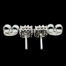Load image into Gallery viewer, A pair of pink sapphire and diamond cluster stud earrings in white gold, on a black background
