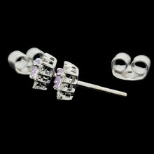 Load image into Gallery viewer, A pair of pink sapphire and diamond cluster stud earrings in white gold, on a black background
