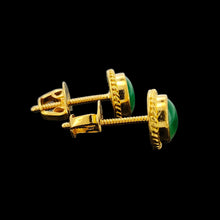 Load image into Gallery viewer, A pair of round jade stud earrings in yellow gold, on a black background
