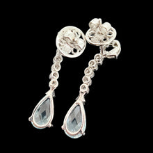 Load image into Gallery viewer, A pair of aquamarine and diamond drop earrings in white gold, on a black background
