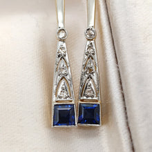 Load image into Gallery viewer, Close-up of a pair of sapphire and diamond long drop earrings in white and yellow gold
