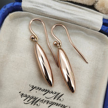 Load image into Gallery viewer, A pair of rose gold elongated drop earrings with hook fittings, in an antique box
