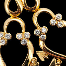 Load image into Gallery viewer, Close-up of a pair of yellow gold open heart shaped drop earrings with diamonds
