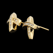 Load image into Gallery viewer, A pair of yellow gold round diamond cross shaped stud earrings, on a black background
