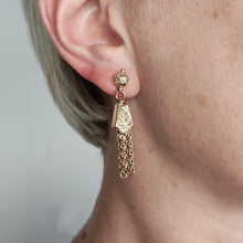 Load image into Gallery viewer, A yellow gold fancy engraved tassel drop earring, modelled in an ear
