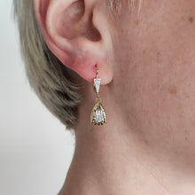 Load image into Gallery viewer, A yellow and white gold diamond set drop earring, modelled in an ear
