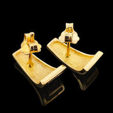 Load image into Gallery viewer, A pair of yellow gold half hoop earrings, on a black background

