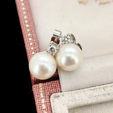Load image into Gallery viewer, A pair of white pearl and round diamond stud earrings in white gold, in an antique box
