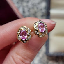 Load image into Gallery viewer, Vintage 9ct Gold Pink Sapphire and Diamond Stud Earrings in hand
