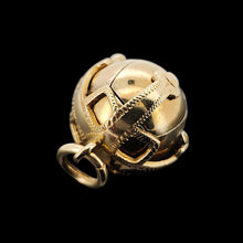 Load image into Gallery viewer, Gold and silver masonic ball pendant on a black background
