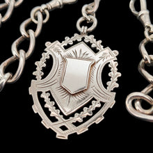 Load image into Gallery viewer, A silver Albert watch chain with large oval links, two lobster clasps, a T-bar and a shield shaped fob medal
