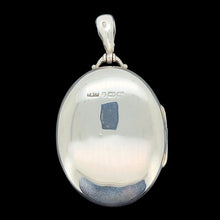 Load image into Gallery viewer, Silver locket with a black background
