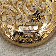 Load image into Gallery viewer, Close-up of a 9 carat gold Birmingham assay hallmark on an engraved oval locket and J.M maker's mark
