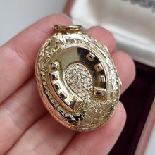 Load image into Gallery viewer, Antique 9ct Gold Back &amp; Front Ornate Horseshoe Locket in hand
