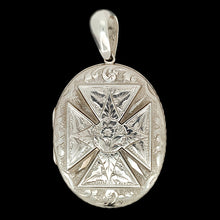 Load image into Gallery viewer, An intricate engraved oval locket pendant in silver, on a black background
