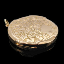 Load image into Gallery viewer, A circular yellow gold engraved locket pendant, on a black background
