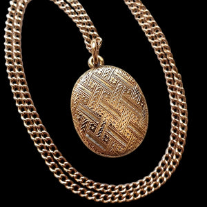 Antique 15ct Gold Mourning Locket with 15ct Gold Chain on a black background