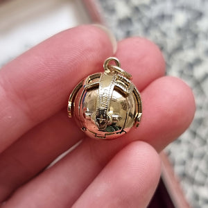 Vintage 9ct Gold Masonic Ball Pendant in hand