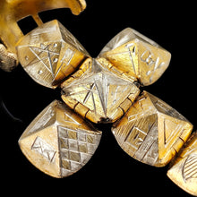 Load image into Gallery viewer, A folding masonic ball fob pendant in gold and silver, on a black background
