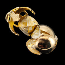 Load image into Gallery viewer, A folding masonic ball fob pendant in gold and silver, on a black background
