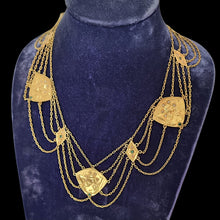Load image into Gallery viewer, Gold necklace with pendants on a blue velvet stand
