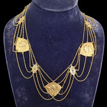 Load image into Gallery viewer, Gold necklace with pendants on a blue velvet stand
