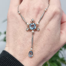 Load image into Gallery viewer, Edwardian Platinum &amp; 18ct Gold Aquamarine, Diamond and Pearl Pendant Necklace in hand
