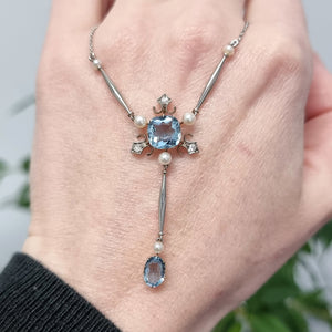Edwardian Platinum & 18ct Gold Aquamarine, Diamond and Pearl Pendant Necklace in hand