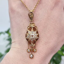 Load image into Gallery viewer, Victorian 15ct Gold Old Cut Diamond Star Drop Pendant with Chain in hand
