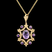 Load image into Gallery viewer, An amethyst and seed pearl fancy pendant in yellow gold with a curb link chain, on a black background
