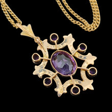 Load image into Gallery viewer, An amethyst fancy pendant in yellow gold with a curb link chain, on a black background
