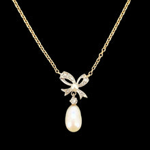 Load image into Gallery viewer, A yellow and white gold pearl and diamond bow pendant necklace
