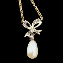 Load image into Gallery viewer, A yellow and white gold pearl and diamond bow pendant necklace
