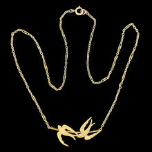 Load image into Gallery viewer, A yellow gold pendant necklace featuring two swallow birds in flight
