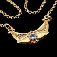 Load image into Gallery viewer, A yellow gold pendant necklace with a round aquamarine
