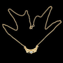 Load image into Gallery viewer, A yellow gold pendant necklace with a round aquamarine
