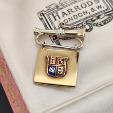 Load image into Gallery viewer, A yellow and white gold flag and bugle charm with an enamel coat of arms, in an antique Harrods box
