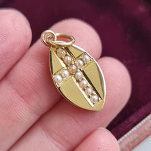 Load image into Gallery viewer, Edwardian 15ct Gold Seed Pearl Cross Pendant in hand
