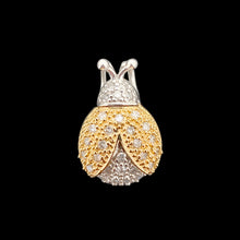 Load image into Gallery viewer, A yellow and white gold diamond set ladybird pendant, on a black background
