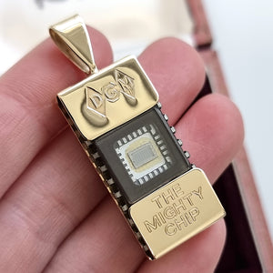 Vintage 9ct Gold "The Mighty Chip" Computer Chip Pendant in hand