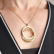 Load image into Gallery viewer, Vintage 14k Gold Pearl Double Circle Pendant modelled with chain
