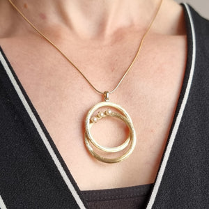 Vintage 14k Gold Pearl Double Circle Pendant modelled with chain