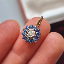 Load image into Gallery viewer, Vintage 18ct Gold Sapphire and Diamond Round Cluster Pendant in hand
