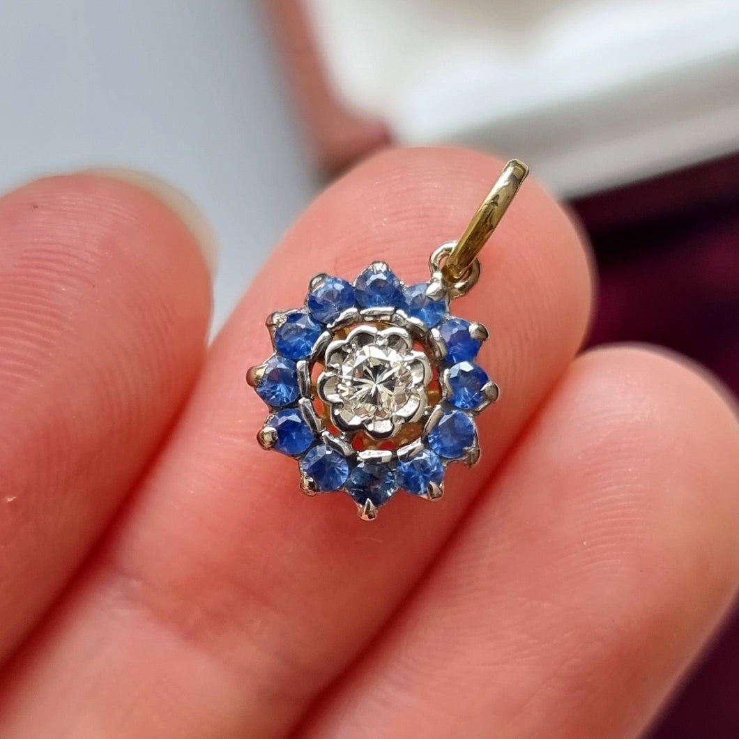 Vintage 18ct Gold Sapphire and Diamond Round Cluster Pendant in hand