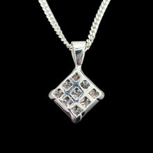 Load image into Gallery viewer, A square shaped diamond cluster pendant in white gold with a curb link chain, on a black background
