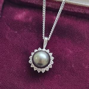 18ct White Gold Black Pearl and Diamond Cluster Pendant front, in box