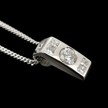 Load image into Gallery viewer, A brilliant and princess cut diamond pendant in platinum, with a white gold curb chain
