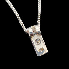 Load image into Gallery viewer, A brilliant and princess cut diamond pendant in platinum, with a white gold curb chain
