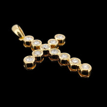 Load image into Gallery viewer, A round diamond cross pendant in yellow gold, on a black background
